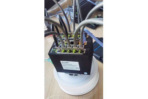 How does the industrial switch resist network attacks through multi-layer protection?